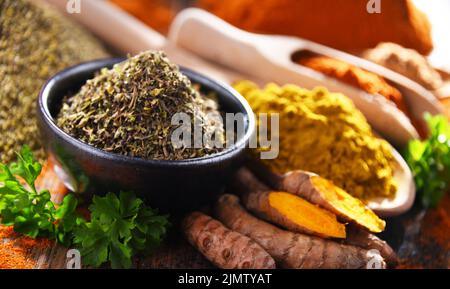Composition with spices on wooden kitchen table. Stock Photo