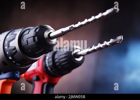 Composition with two cordless drills also working as screw guns Stock Photo