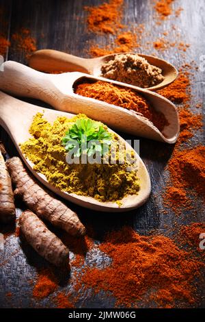 Composition with spices on wooden kitchen table. Stock Photo