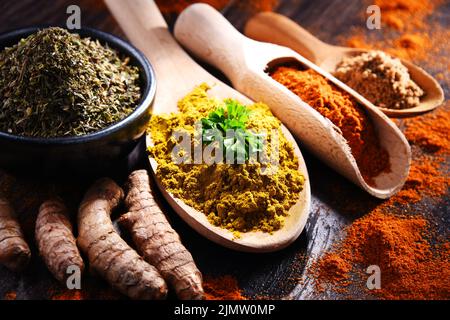 Composition with spices on wooden kitchen table. Stock Photo