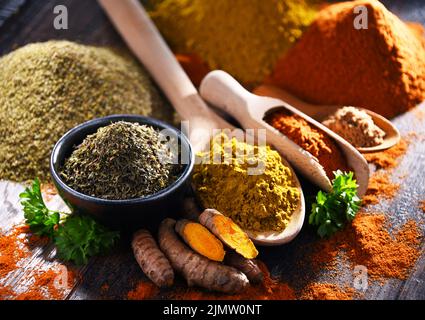 Composition with spices on wooden kitchen table. Stock Photo