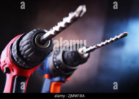 Composition with two cordless drills also working as screw guns Stock Photo