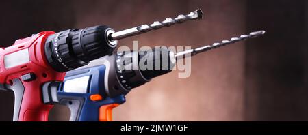 Composition with two cordless drills also working as screw guns Stock Photo