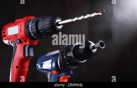 A pistol-grip cordless drill and a screw gun. Stock Photo