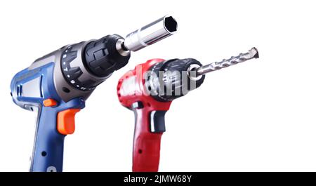 A screw gun and a pistol-grip cordless drill isolated on white background Stock Photo