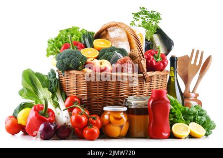 Wicker basket with assorted grocery products Stock Photo