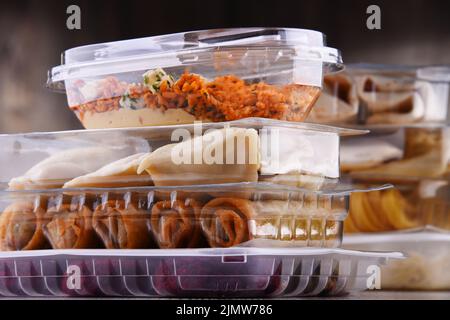 A variety of prepackaged food products in plastic boxes. Stock Photo