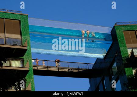 London, UK, 7th Aug, 2022. Swimmers in the suspended, transparent Skypool in Vauxhall make the most of the hot and dry weather with no rain forecast for the foreseeable. Temperatures are set to climb to 30 degrees as the week progresses. Credit: Eleventh Hour Photography/Alamy Live News Stock Photo