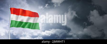 Hungarian flag on a cloudy sky Stock Photo