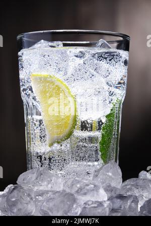 Glass of mineral carbonated water with crushed ice and mint leaves on ...