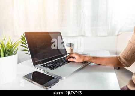 Web application development. programmer woman writing program code sitting at workplace in office, software developer hands coding HTML programming wi Stock Photo