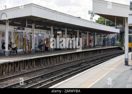 Staines railway station near London, with people waiting for a train to Windsor or Reading Stock Photo