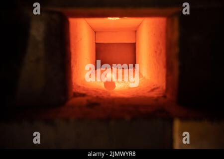 Hot piece of iron lies in the oven Stock Photo