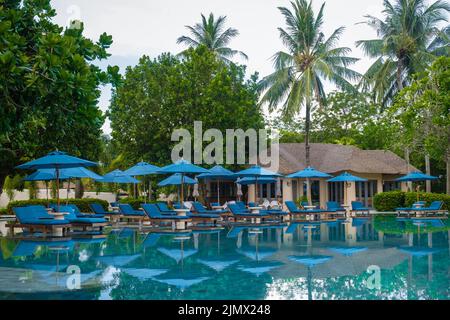 Aerial view of Naka Island near Phuket Thailand, tropical Island in Thailand with beach chairs in the pool Stock Photo