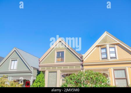 Victorian row of houses with gable roofs Stock Photo - Alamy