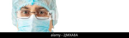 Male caucasian medical worker looking straight ahead in protective mask headshot portrait closeup on white background banner moc Stock Photo