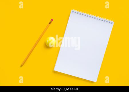Composition notebook pencil yellow magnet Stock Photo