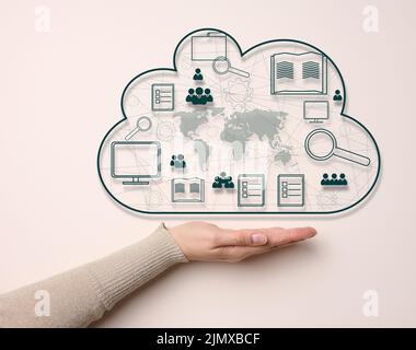 Woman's hand on a beige background. Cloud data storage, information exchange and secure data storage Stock Photo