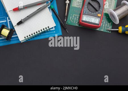 Close up circuit board with multimeter Stock Photo