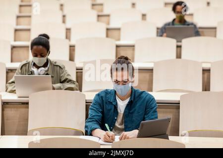 Young students attending class Stock Photo