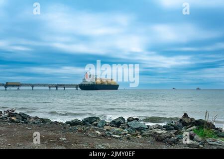 liquefied natural gas carrier tanker during loading at an LNG offshore terminal Stock Photo