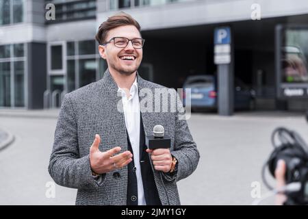 Smiley journalist job Stock Photo