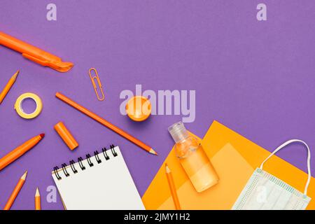 Supplies arrangement purple background Stock Photo