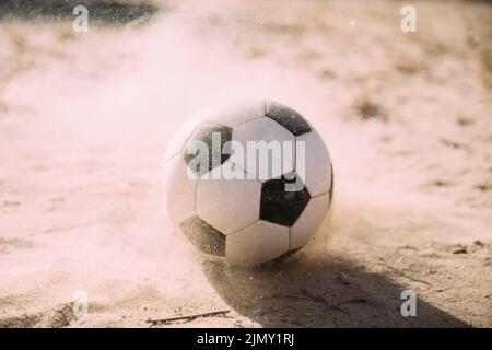 Soccer ball sand particles Stock Photo