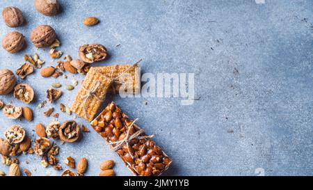 Sweet protein bar with dried fruits concrete background Stock Photo
