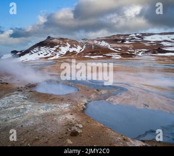 The Namafjall Geothermal Area, Iceland, on the east side of Lake Myvatn. At this area, also known as Hverir, are many smoking fu Stock Photo