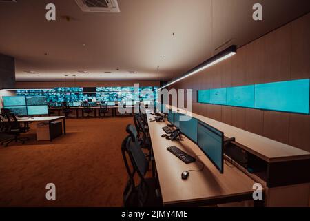 Empty interior of big modern security system control room, workstation with multiple displays, monitoring room with at security Stock Photo