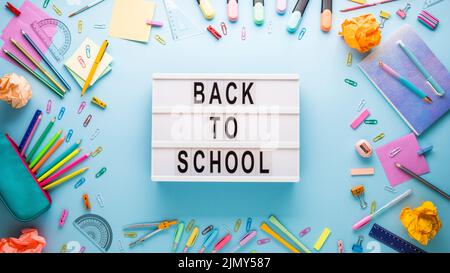 School stationery on a blue background. Back to school creative photo Stock Photo