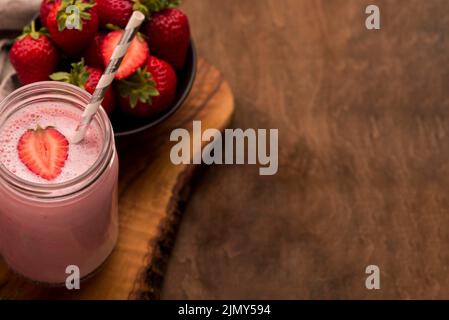 High angle strawberry milkshake with straw copy space Stock Photo