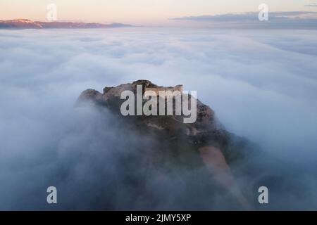 Aerial view of a medieval Castle in a beautiful foggy sunset, Poza de la sal, Burgos, Spain. High quality photography. Stock Photo