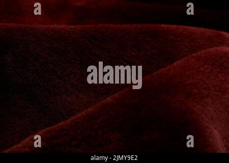 loosely laid deep red soft fur Stock Photo