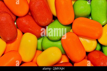 Colorful candy background, vibrant multi color candies, macro full frame image. Stock Photo
