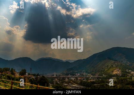 sun rays and clouds in the blue sky Stock Photo