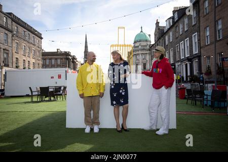 Edinburgh. Scotland, UK. 8th Aug, 2022. Photocall: Launch of Kostya Benkovich's new sculpture The Suitcase highlighting the plight of refugees worldwide. The sculpture is made from reinforced steel, which is also used to make prison bars in Russia. The Suitcase will be displayed at Assembly Rooms, George Street, Edinburgh from 8th - 29th August. Entry is free. Pictured: (L-R) Kostya Benkovich, Lezley Marion Cameronand  Alexandrina Markvo. Pic Credit: Pako Mera/Alamy Live News Stock Photo