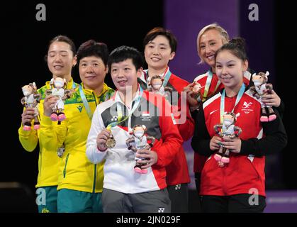 Australia's Minhyung Jee and Jian Fang Lay, silver, Singapore's Tianwei Feng and Jian Zeng, gold, and Wales' Charlotte Carey and Anna Hursey, bronze, after the Women's Doubles table tennis at The NEC on day eleven of the 2022 Commonwealth Games in Birmingham. Picture date: Monday August 8, 2022. Stock Photo