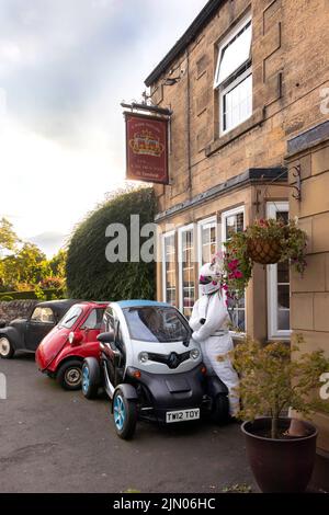 renault twizy and classic red bubble car outside the Crown pub in the ...