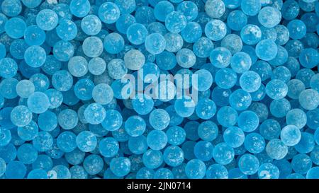 Lots of frosted blue glass ball poured into the ground for foot massage. Stock Photo