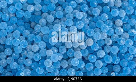 Lots of frosted blue glass ball poured into the ground for foot massage. Stock Photo