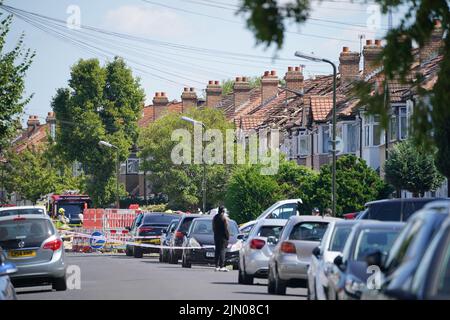 Emergency services at the scene in Galpin's Road in Thornton Heath, south London, where the London Fire Brigade (LFB) report that a house has collapsed amid a fire and explosion. Picture date: Monday August 8, 2022. Stock Photo