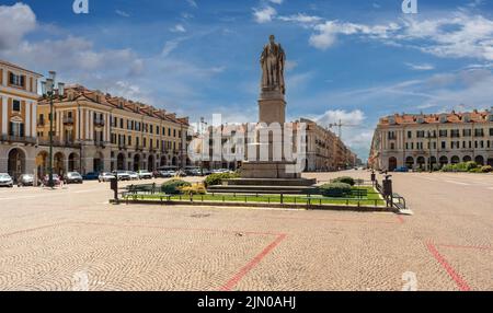 Cuneo, Piedmont, Italy - August 06, 2022: Statue of Giuseppe Barbaroux in the center of the Tancredi Duccio Galimberti square, in the background the b Stock Photo