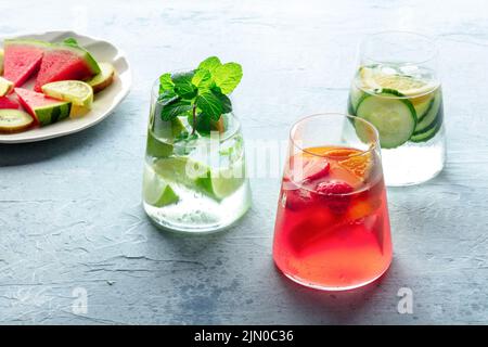 Summer cocktails. Cold drinks with fresh fruits. Healthy mocktails. Glasses of lemonade with ice Stock Photo