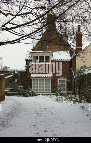 Brick house covered with snow in Norwich during winter Stock Photo