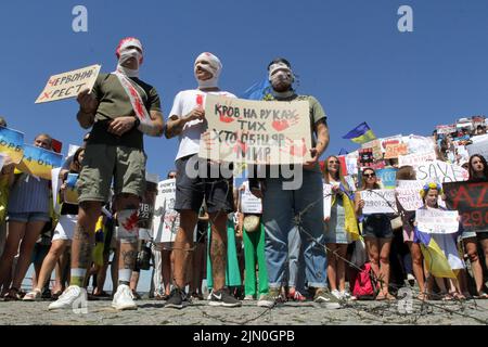 Dnipro, Ukraine. 07th Aug, 2022. DNIPRO, UKRAINE - AUGUST 07, 2022 - People hold placards during the action in support of the Azovstal POWs at the Festival Pier to draw global attention to the russian terrorist attack in Olenivka, Dnipro, eastern Ukraine. This photo cannot be distributed in the russian federation. Credit: Ukrinform/Alamy Live News Stock Photo