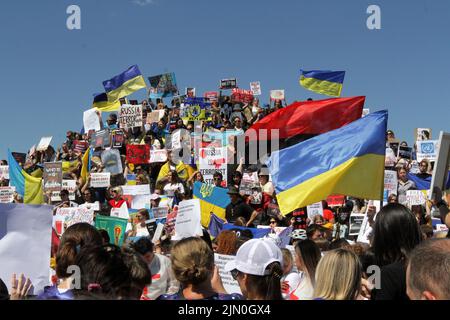 Dnipro, Ukraine. 07th Aug, 2022. DNIPRO, UKRAINE - AUGUST 07, 2022 - People hold flags and placards during the action in support of the Azovstal POWs at the Festival Pier to draw global attention to the russian terrorist attack in Olenivka, Dnipro, eastern Ukraine. This photo cannot be distributed in the russian federation. Credit: Ukrinform/Alamy Live News Stock Photo