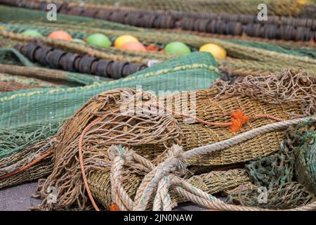 Colored nets and ropes on a quay of a Dutch harbour Stock Photo - Alamy