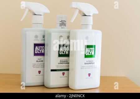 Three AutoGlym car care cleaning products on table Stock Photo